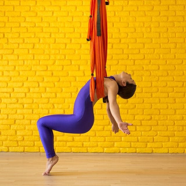 Aerial Yoga Benefits Back Pain Relief, Weight Loss + More Science