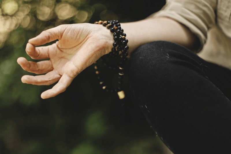 To practice Gyan mudra, bring the tips of your thumb and index finger together and extend your other three fingers.