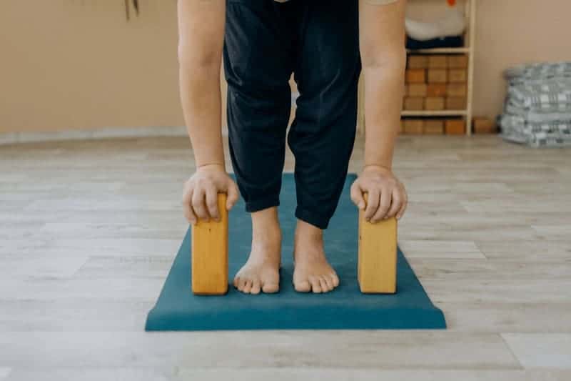 If you have super tight hamstrings, try placing blocks under your hands as you lift into Ardha Uttanasana to avoid straining your back.